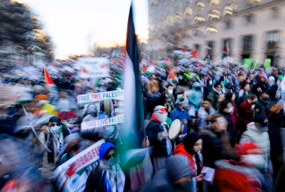Muslim students gathered for a march, carrying placards in solidarity